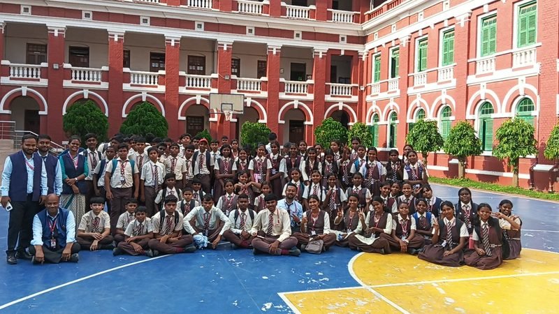 Loyola English Medium School students and teachers in uniform on an educational outing