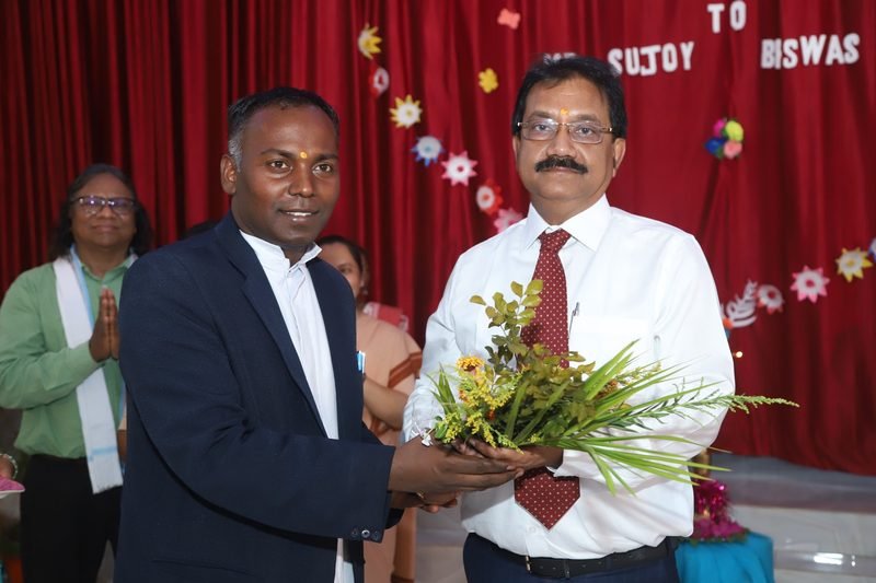 A guest being welcomed with a bouquet at a school programme